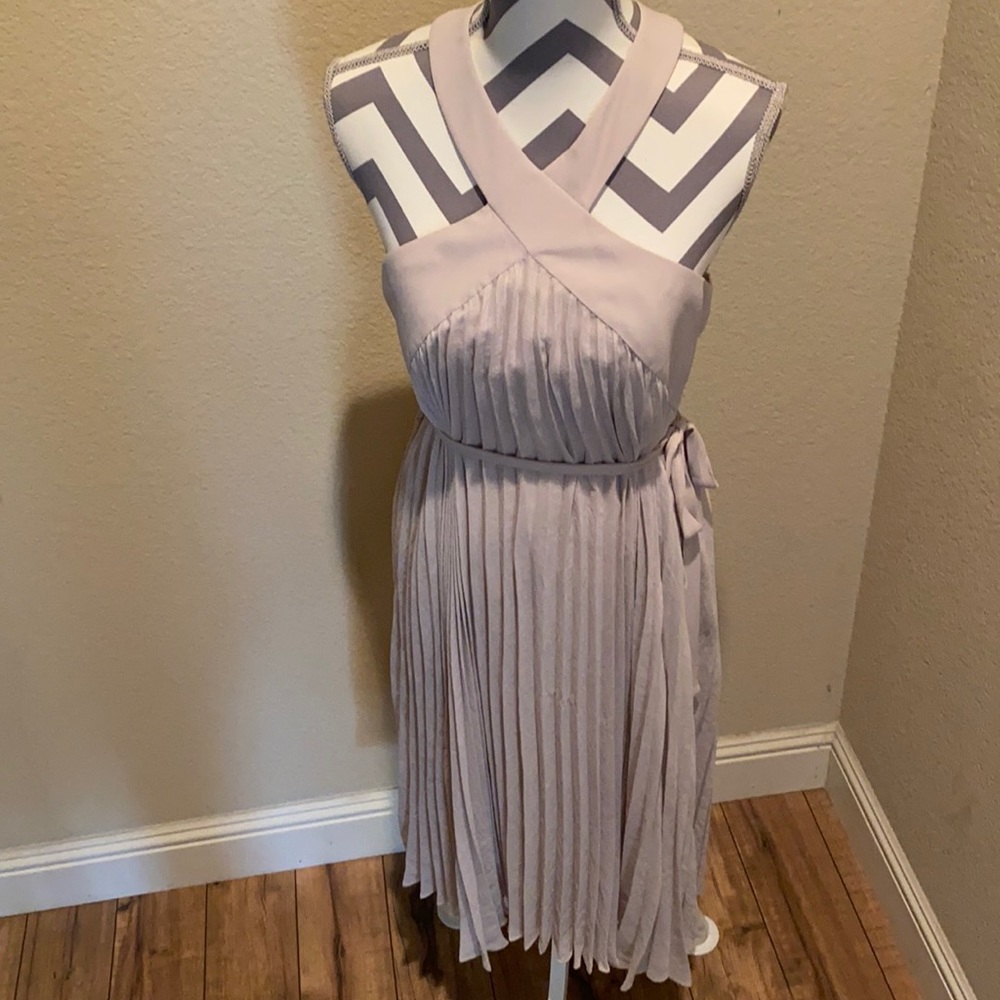 BCBG beige size 10 dress, pleated skirt, X cross front